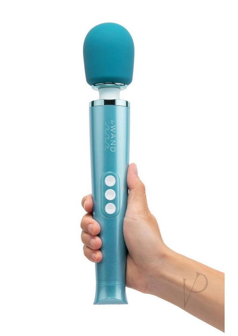 Le Wand Dive waterproof wand massager in blue, held in one hand for scale