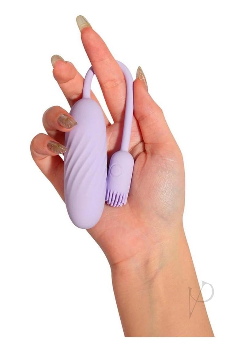 Svakom Plume dual vibrator in purple, held in one hand for scale