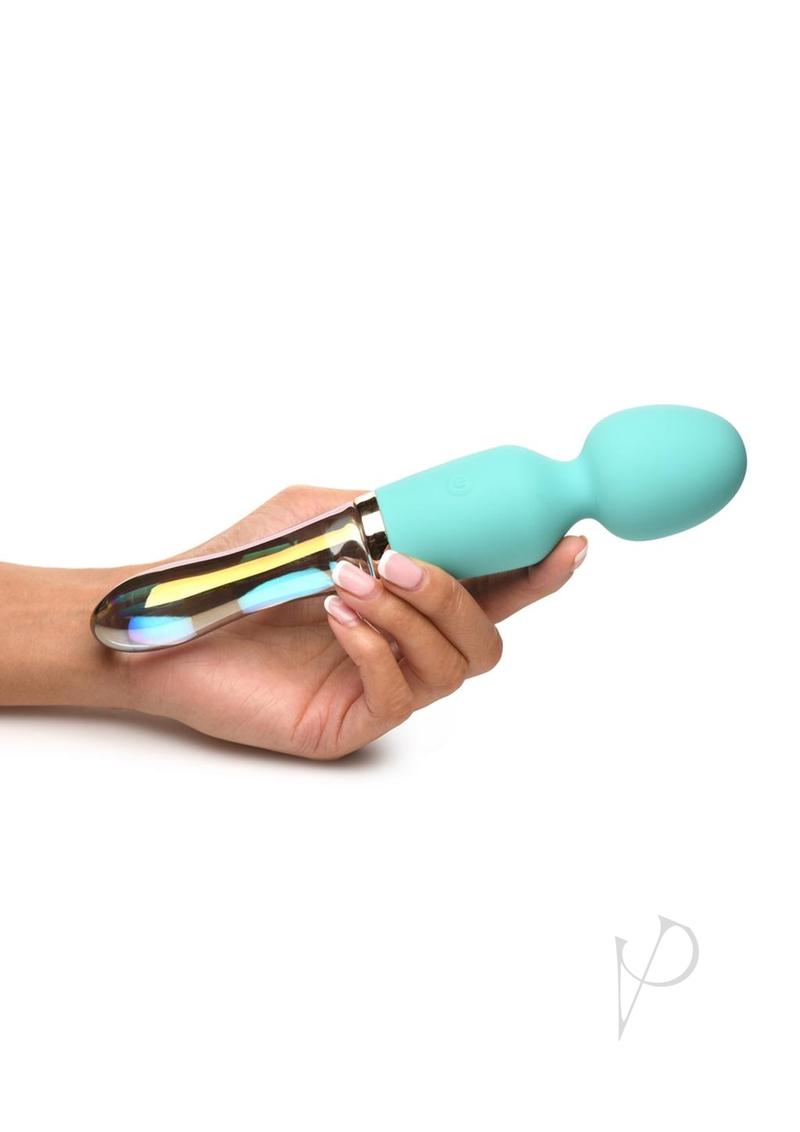 Prisms Vibra-Glass 10X dual-ended vibrator in turquoise, held in one hand for scale