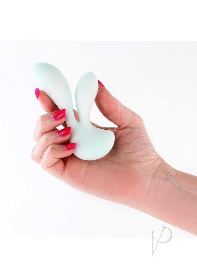 NS Novelties Pure Luna rabbit vibrator in teal, held in one hand for scale