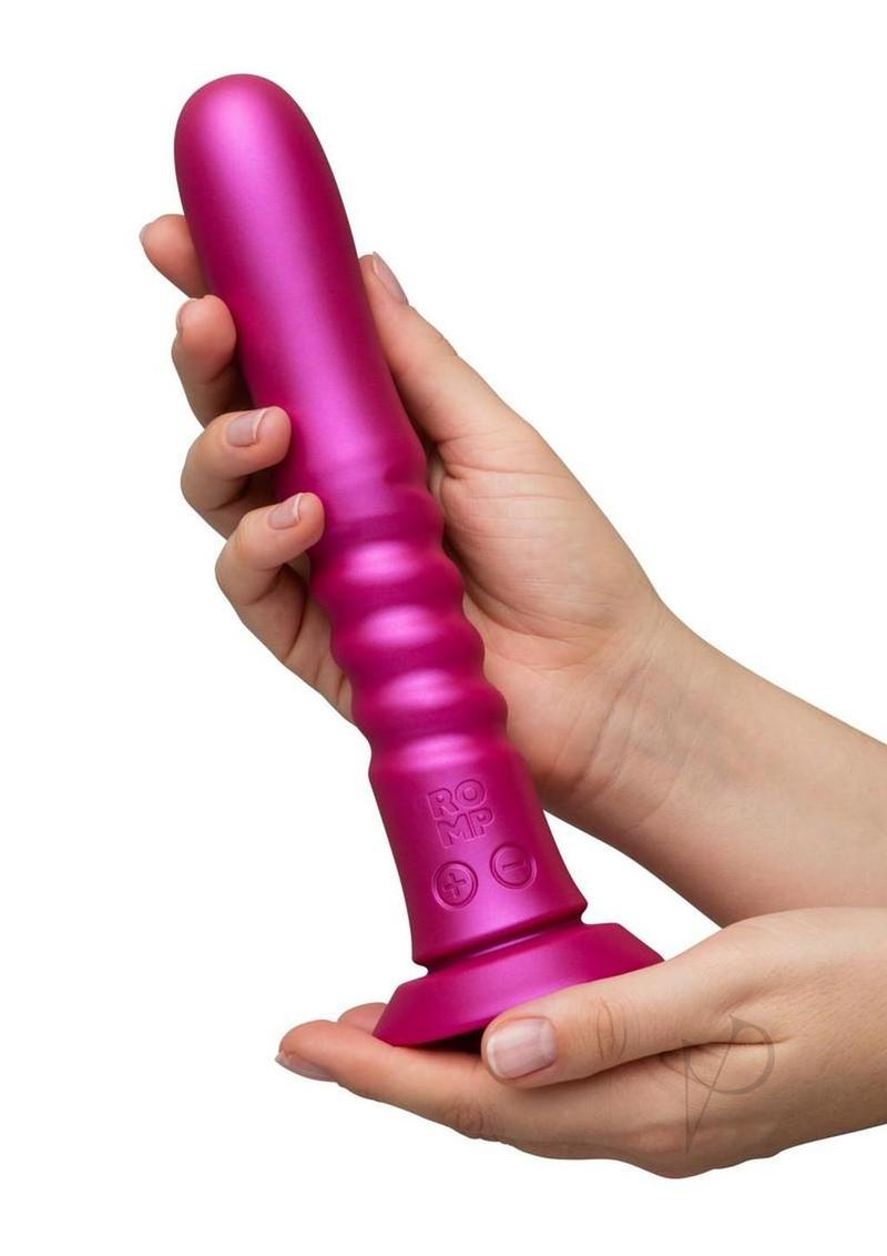 ROMP Jiggle thrusting vibrating dildo in pink, held in one hand for scale