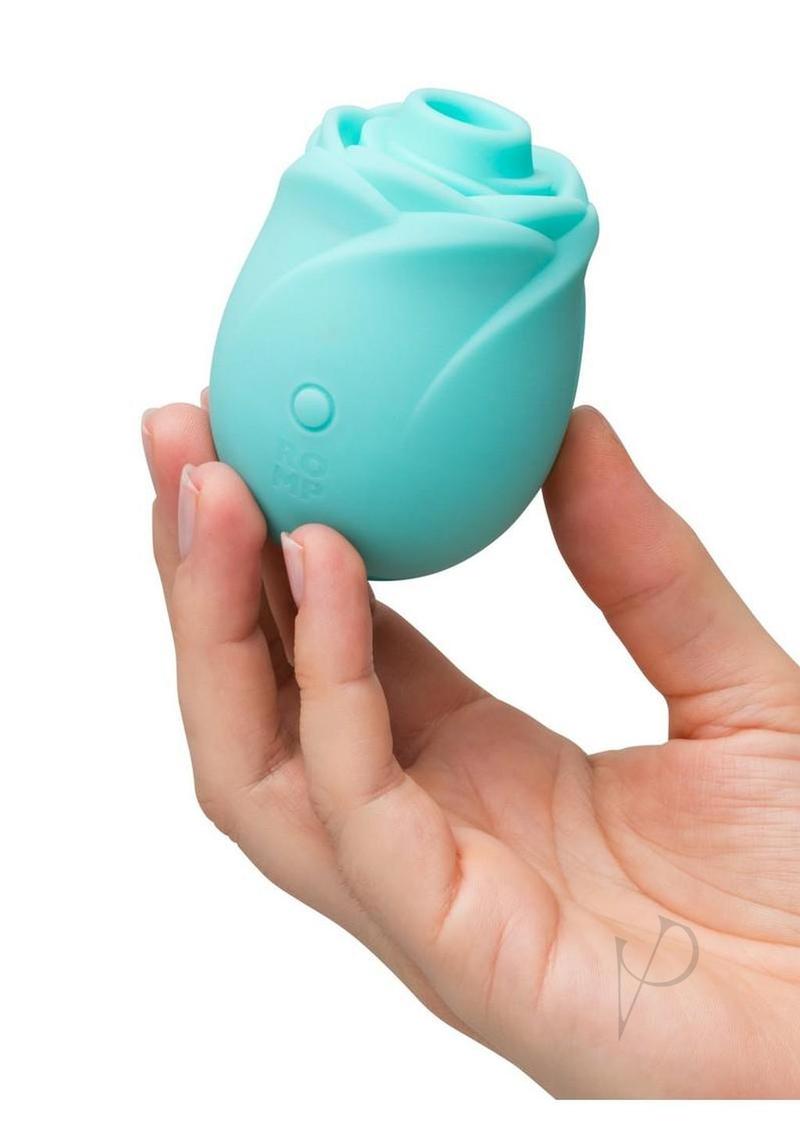 ROMP Rose Glow air pulse stimulator in blue, held in one hand for scale