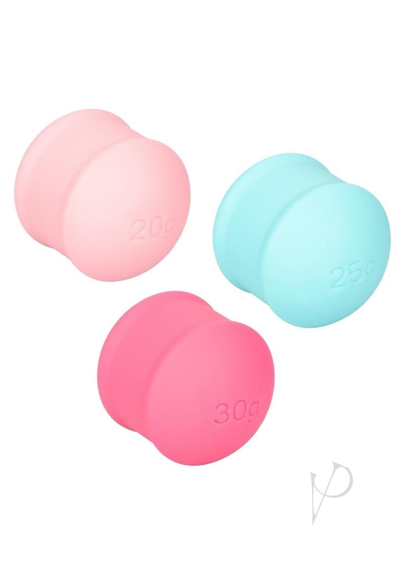 She-ology interchangeable weight kegel set, six weighted silicone balls in assorted colors with single and double holders, three of the weights up close
