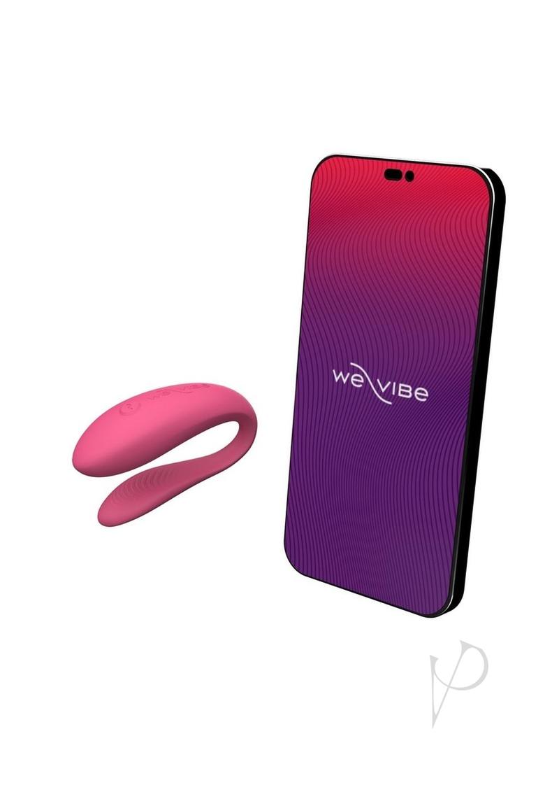 We-Vibe Sync Lite couples vibrator in pink, next to a phone running the app